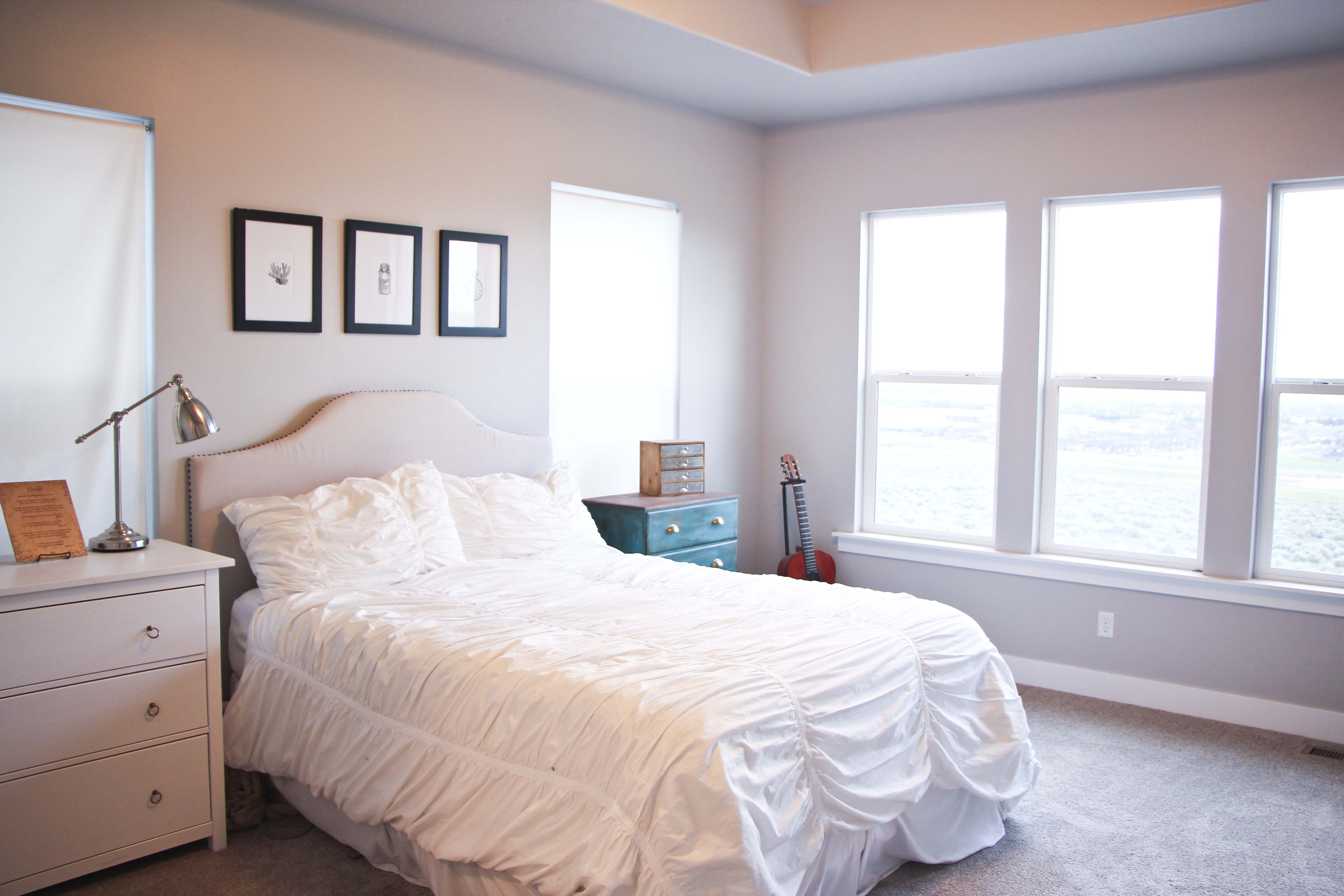 coastal bedroom with dark furniture